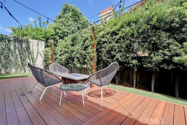 Newly installed grass turf and landscaping throughout backyard.