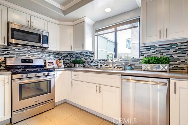 Stunningly remodeled, all stainless stove, dishwasher (near new), and microwave. Stone counters, glass tile backsplash, farm sink, soft close cabinets and drawers. Stunningly remodeled, all stainless stove, dishwasher (near new), and microwave. Stone counters, glass tile backsplash, farm sink, soft close cabinets and drawers.