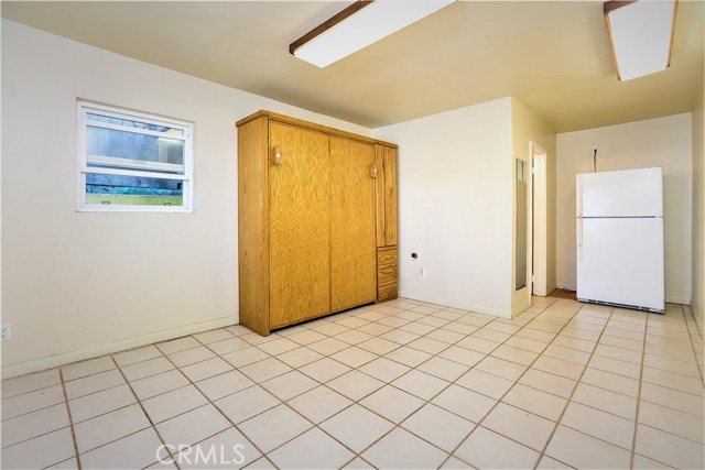 The room has an alcove adjoining the 3rd full bath.  This area can accommodate a table are office desk.