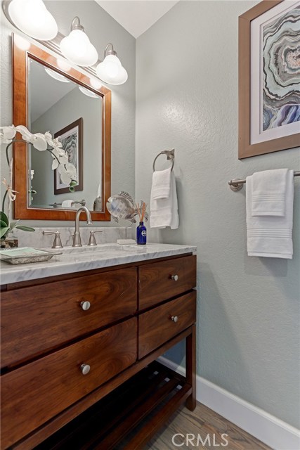 Remodeled powder room with new vanity and paint.