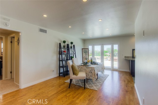 The french doors in the dining room filter the natural light and provide a picturesque snapshot of the back yard.