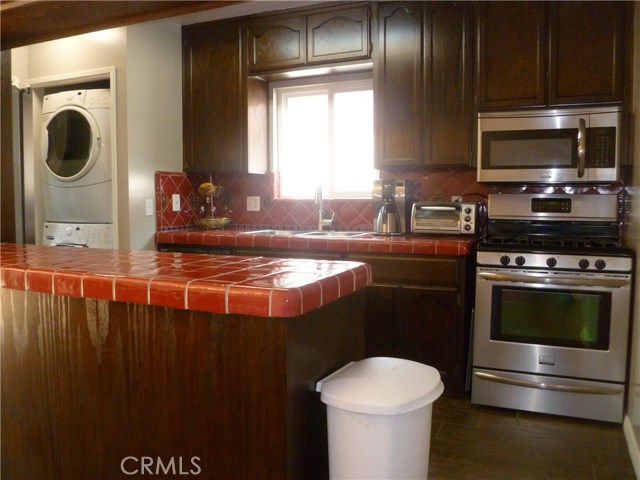 remodeled kitchen with new appliances and tile counters