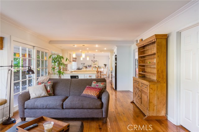 Bright and airy open concept family room, kitchen, and dining room that open up to the backyard.