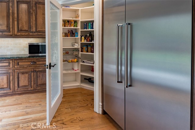 Walk in pantry in kitchen.