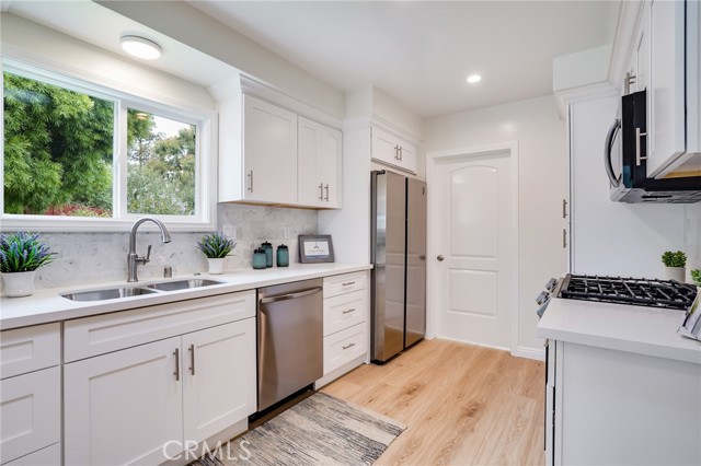 Brand new kitchen with new appliances and Carrara Marble backsplash.