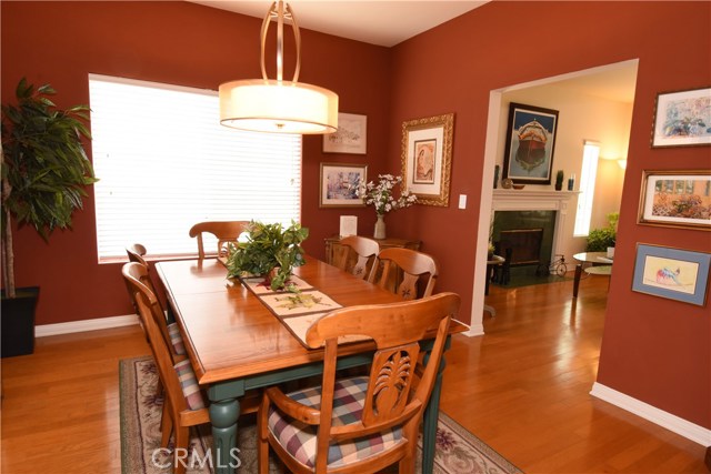 Large formal dining room with living room beyond