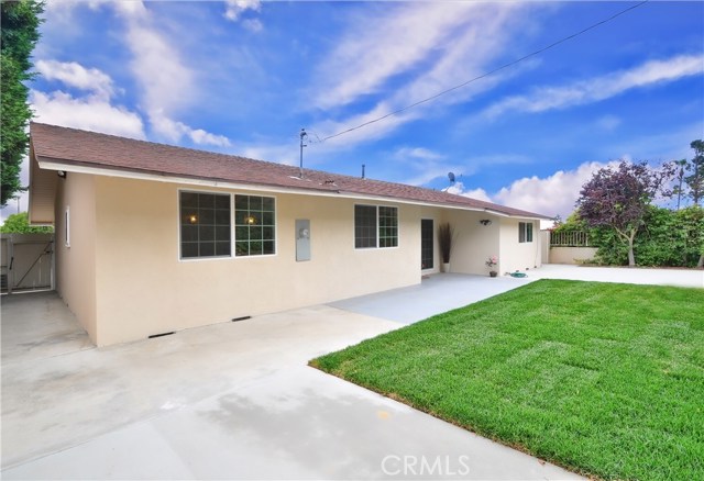 Spacious Low Maintenance Fenced Backyard has 2 Patios for entertaining.