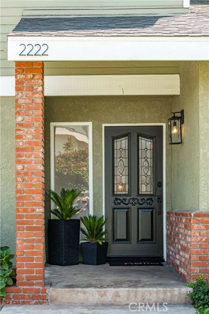 Entrance features new door hardware, exterior lighting and a RING door bell.