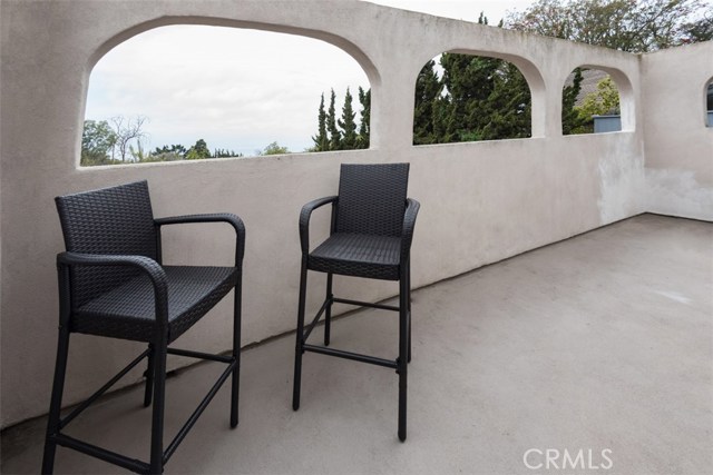 Master Suite Balcony with Spanish Arches framing Catalina Views (cloudy day during photography).