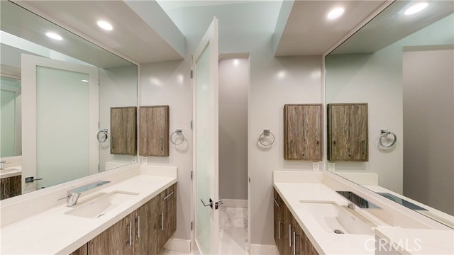 HIS AND HER SINKS WITH PRIVATE WATER CLOSET