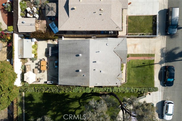 Aerial view of this unique 1 1/2 lot property.  Parkette to the west.