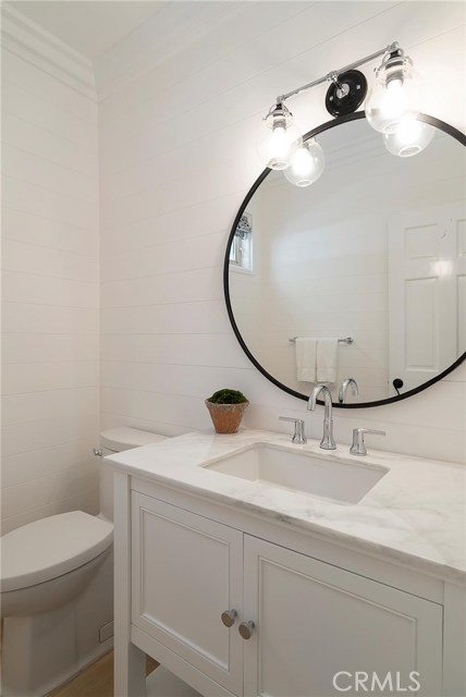 Downstairs powder room with shiplap siding