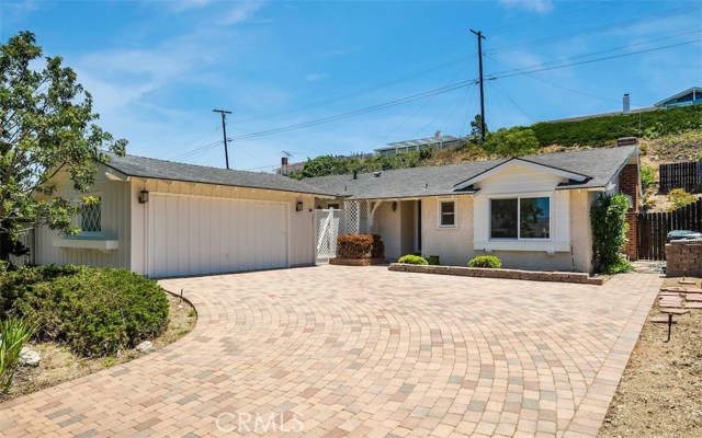 Great curb appeal with the custom paver driveway.