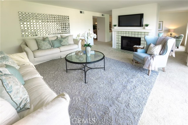 Another view of the Living Room w/fireplace and Family Room behind it.