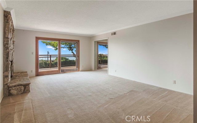 Large Living Room adjoining separate Dining Room, both with access to back deck