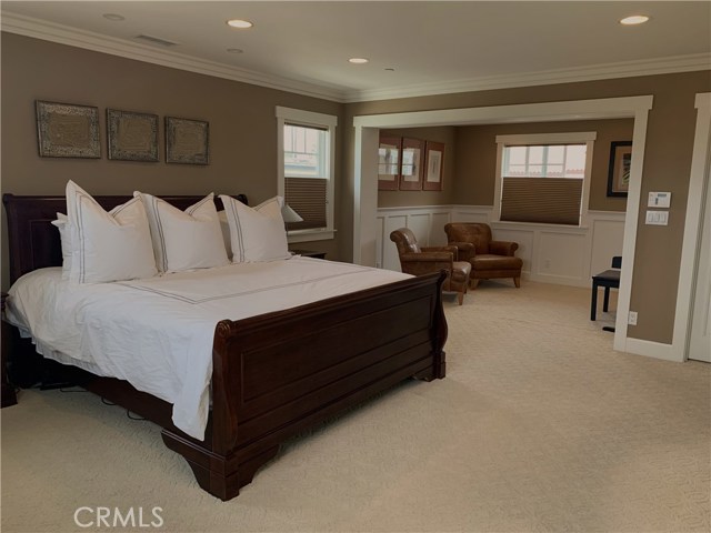 Master bedroom with fireplace and sitting room