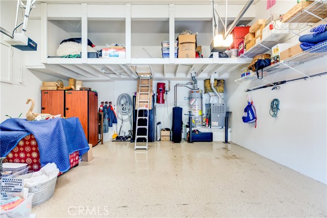 The garage is a storage fanatic's dream! Built in racks and upper storage area with ladder makes it easy to keep all your treasures organized but our of the way.