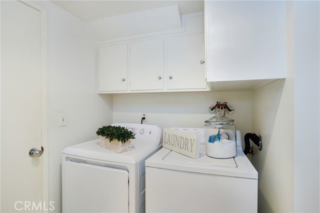 Inside laundry with storage just off family room (washer and dryer included)