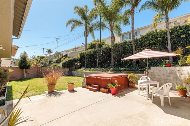 Nice sunny, fenced backyard! Spa is included but not warranted.