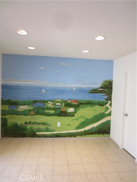 Dining Area with art wall and entry to downstairs bathroom
