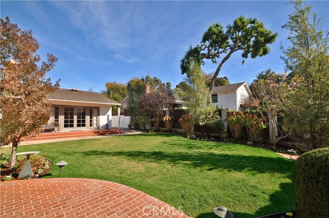 A Wall of French Doors Open to Backyard to Expand Indoor/Outdoor Entertaining