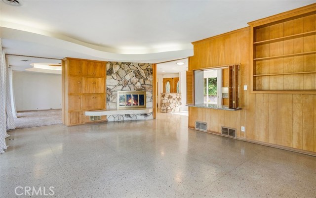 Large Family Room with Fireplace and Book Shelves