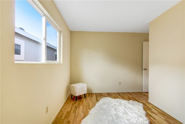 Refinished hardwood flooring with new window and just painted.