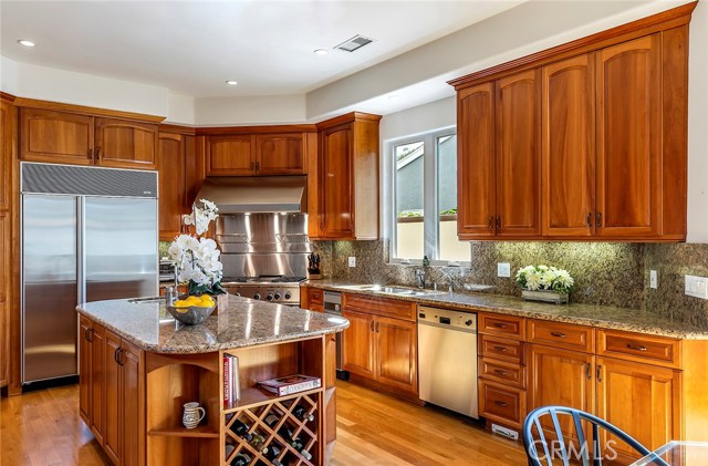 Two Subzero refrigerators, Two Miele Dishwashers, Thermador Professional oven, Thermador Microwave.