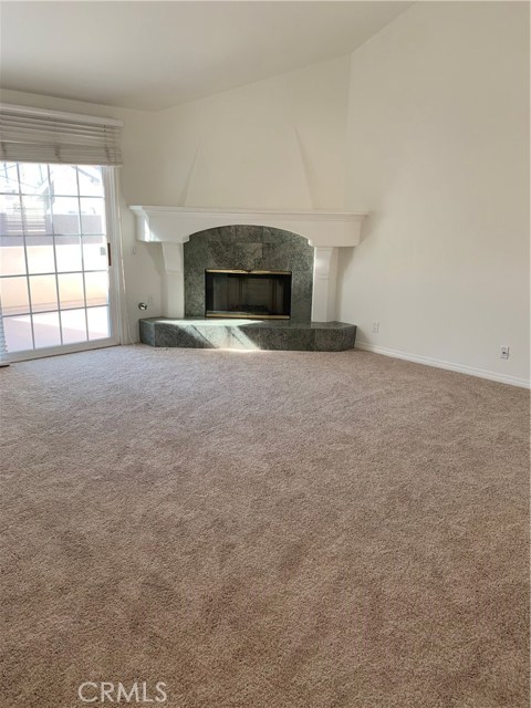 Living room with FP and access to Deck