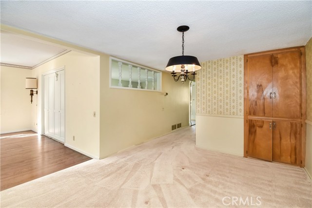 Formal dining room to family room on one side, front hall on the other