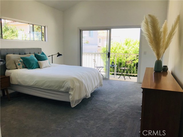 A welcoming presence, with a balcony, walk-in room closet, soaring ceilings in both the master bedroom and en-suite bath this room can accommodate your larger furniture and allow you the breathing space you need.