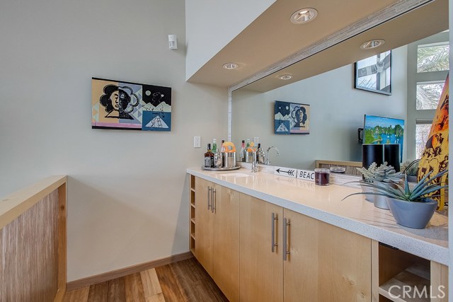 Modern Wet bar perched a step above the living space!