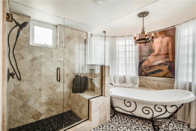The master bath includes a walk in shower and gorgeous soaking tub