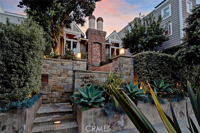 Fantastic curb appeal with stone entry leading to your private patio!