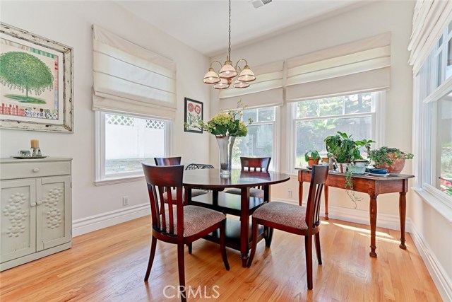 Quaint breakfast nook is adjacent to the kitchen and overlooks the backyard.