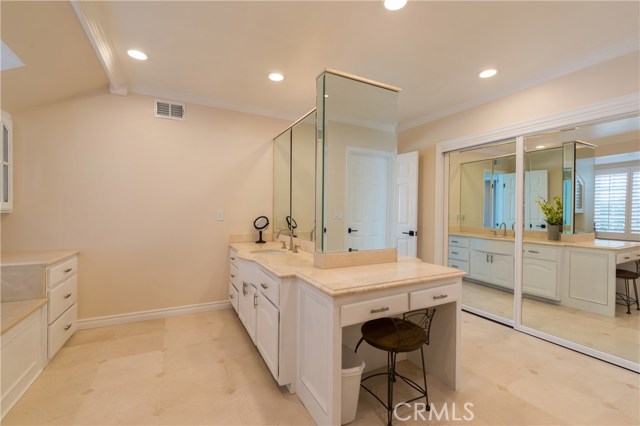Another view of the huge master bathroom!  So much counter space, and even a seated make up area!      Bath tub is to the left, just out of sight.