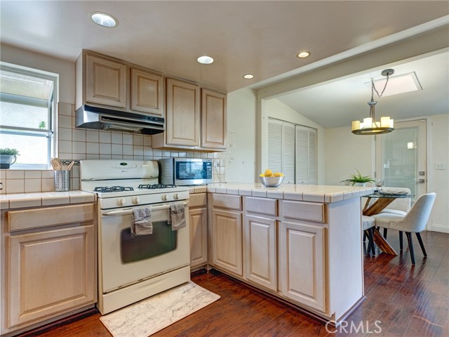 The open kitchen and dining room area provide ample space for hosting friends and family.