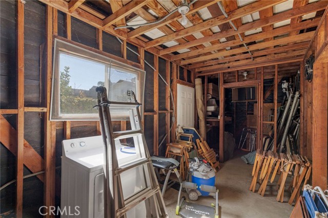 This is the framed office or workshop area and part of the garage. Dryer is just being stored here.