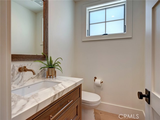 Main level powder room for guests.