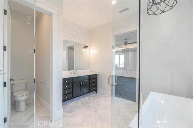 View of master bathroom vanity from walk-in shower.
