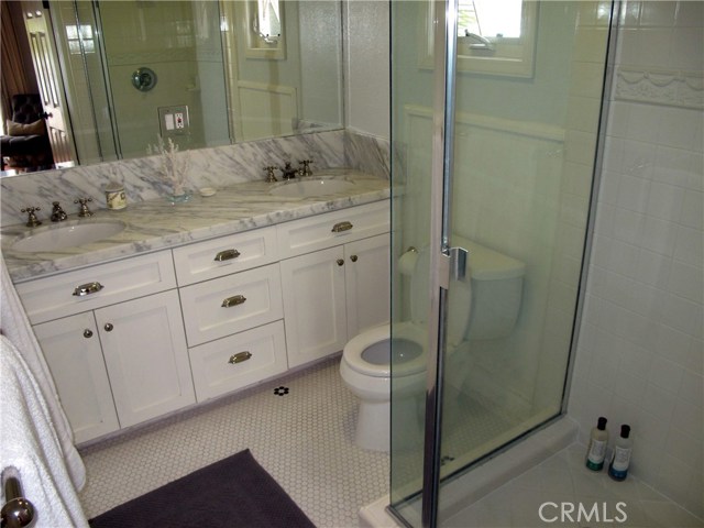 Master Bathroom with Carrera marble countertops and dual sinks