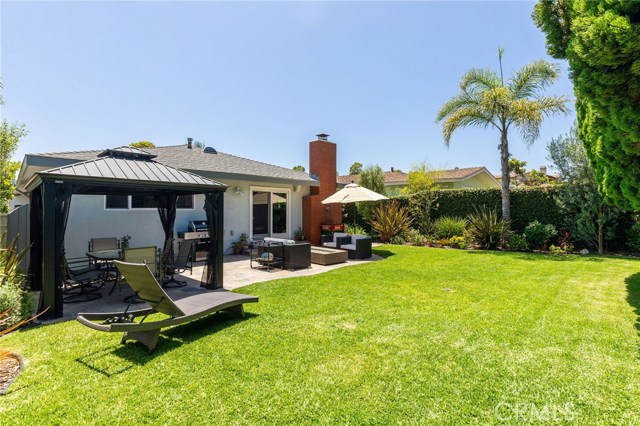 Fantastic backyard has sunny exposure, big grass lawn, tiled patio that leads into family room and complete privacy from neighbors! Mature trees also provide shade and no utility wires overhead. Great yard for kids, pets and entertaining. Patio is perfect for Al-fresco dining.