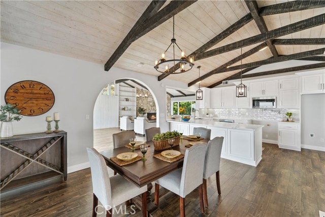 Top floor view of kitchen dining and living room in the distance.