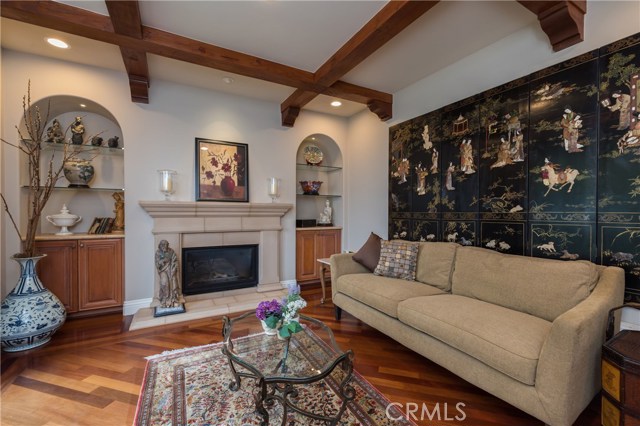 Elegant Den/Study/Office with fireplace and tall French doors to the front yard.  This could possibly be utilized as a 6th bedroom if a closet were added.