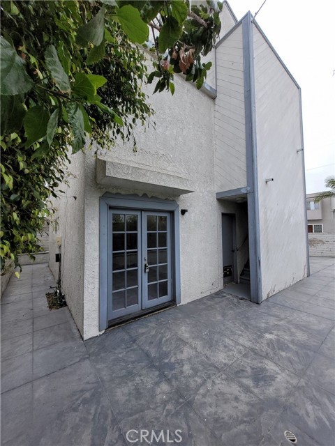 North Side of House with Doors to Bonus Room and Outside Staircase