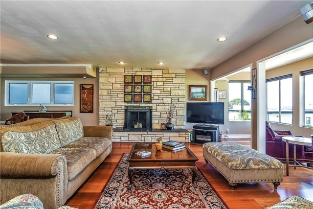 The wall fireplace is fronted in flagstone and has a wide slate hearth