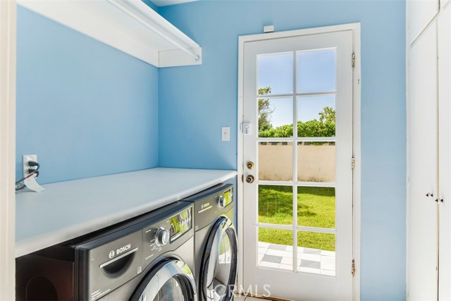 Laundry Room with folding counter and storage closets