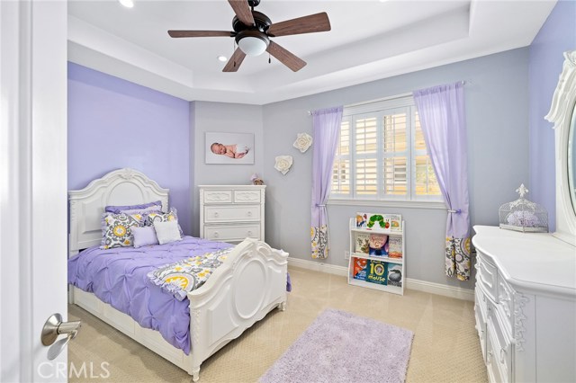 Downstairs bedroom with wood shutters