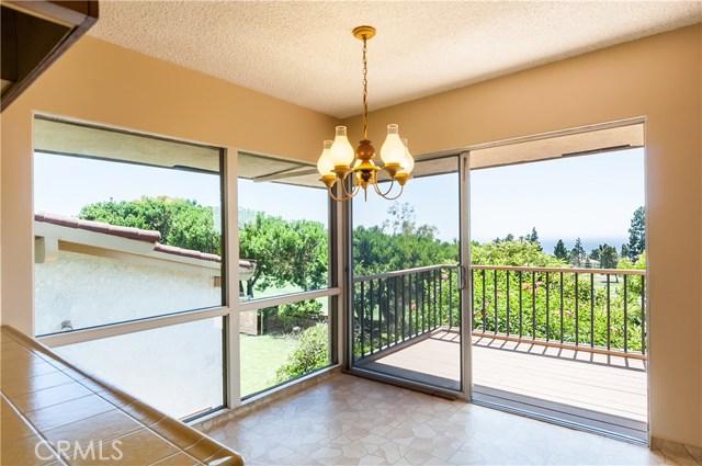 Walls of glass in kitchen nook overlooks the view.