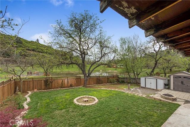 Oversized & fenced backyard with beautiful views of the pond